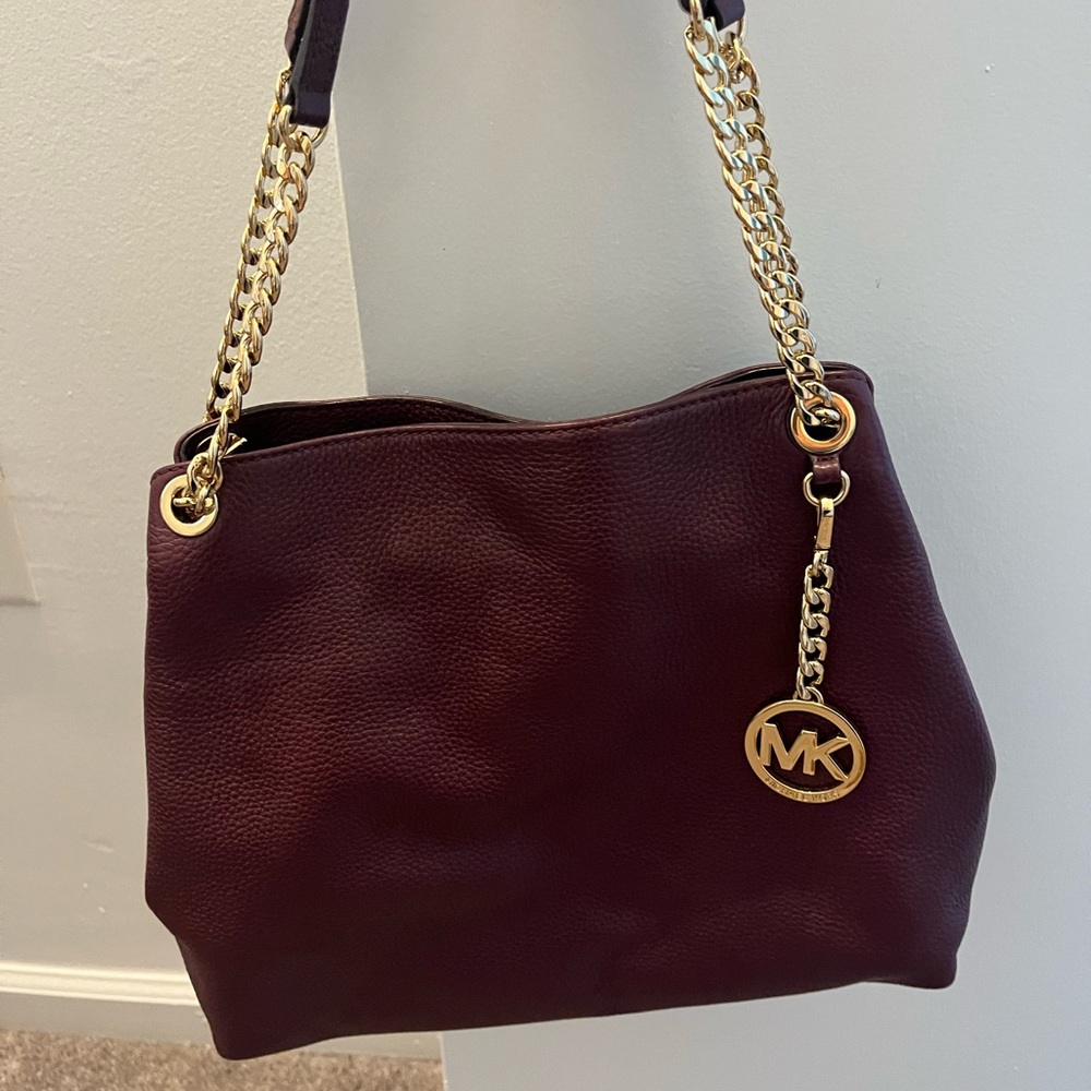 Wine colored Michael Kors double strapped shoulder bag.